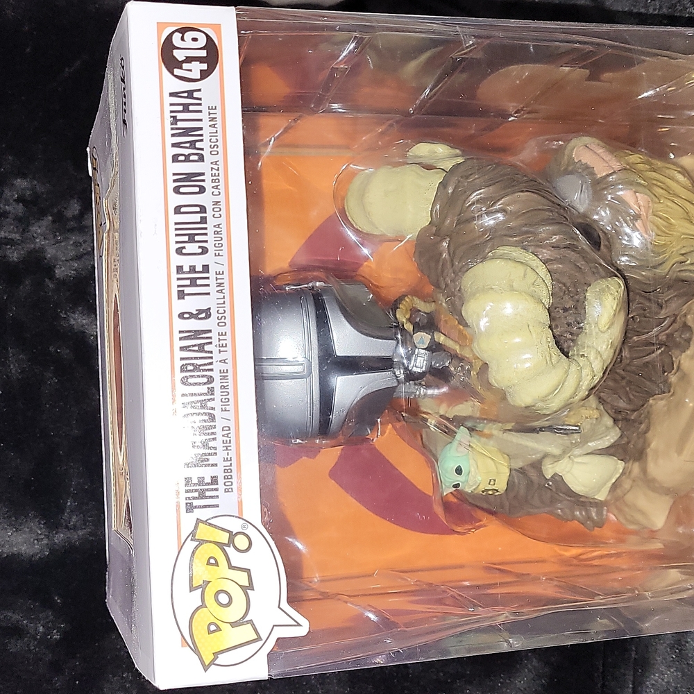 The mandalorian and the child on bantha pop